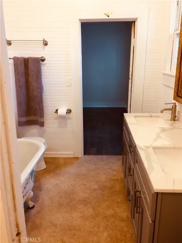 a bathroom with a sink and mirror