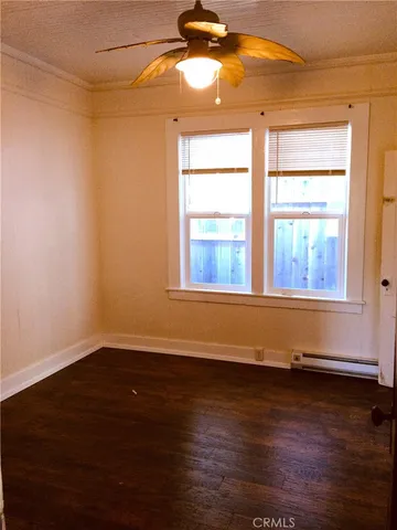 a backyard of a house with barbeque oven