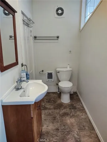 a view of a dining room with furniture and window