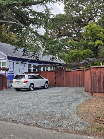a view of street with parked cars