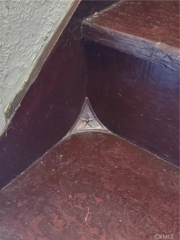 a room with a bed and windows