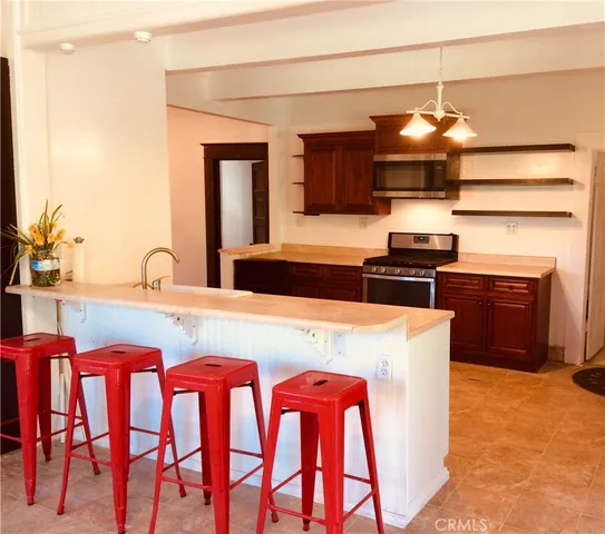 a bathroom with a granite countertop sink a toilet and bathtub