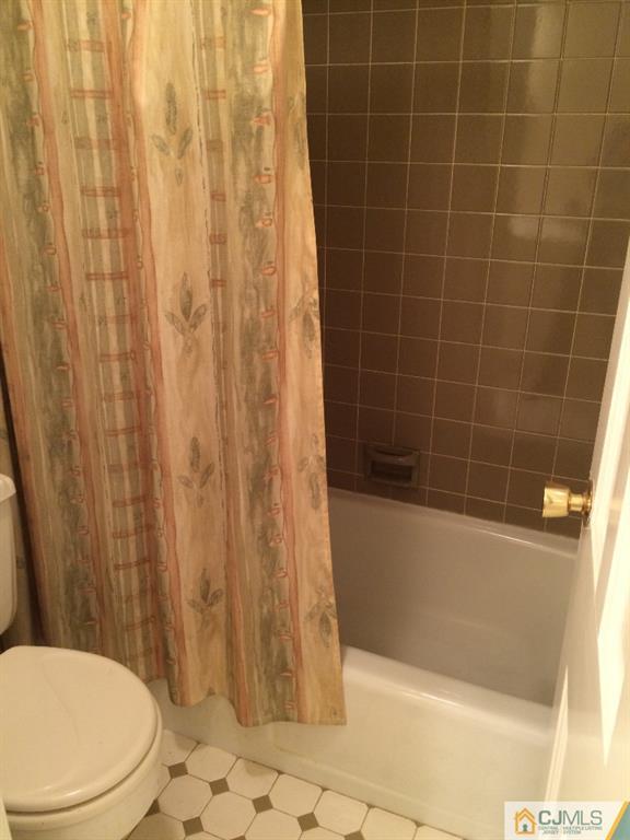 10 Carpender Road New Brunswick, NJ 08901 - Photo 12 of 25 a bathroom with a toilet and shower