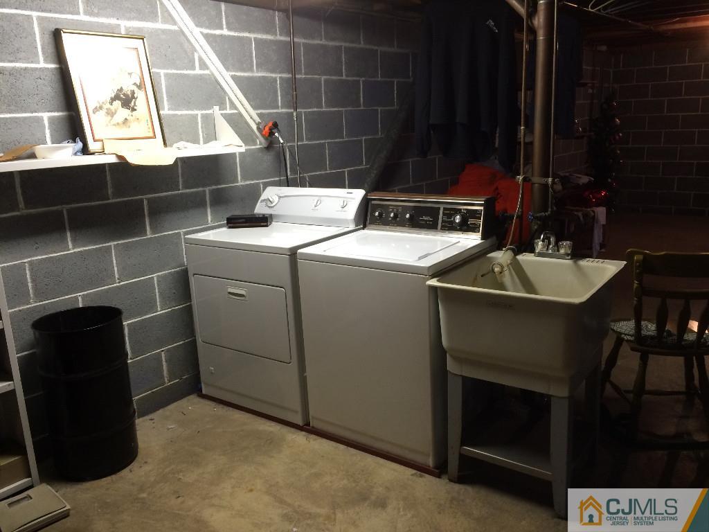 10 Carpender Road New Brunswick, NJ 08901 - Photo 22 of 25 a utility room with dryer and washer