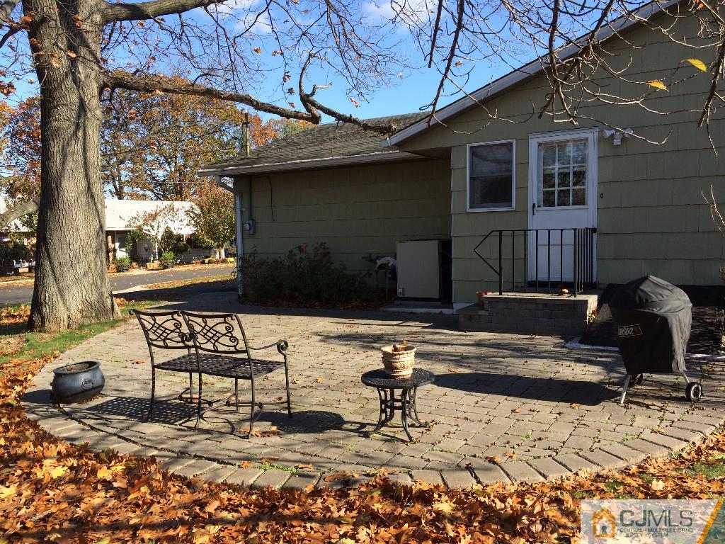 10 Carpender Road New Brunswick, NJ 08901 - Photo 23 of 25 a backyard of a house with table and chairs