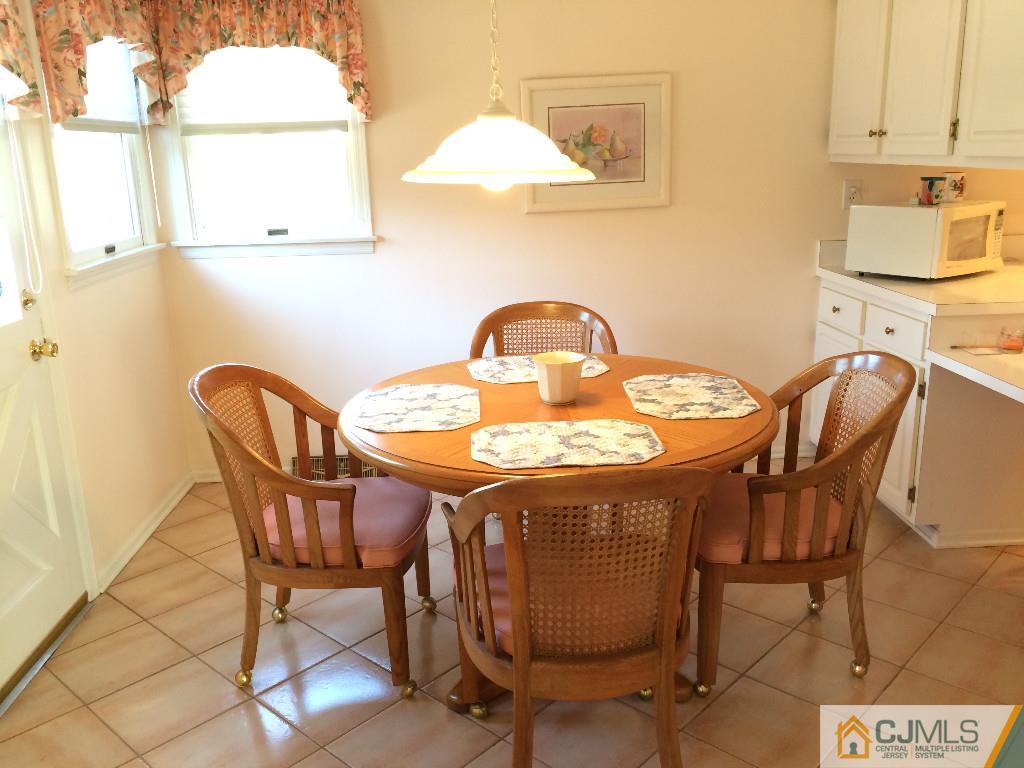 10 Carpender Road New Brunswick, NJ 08901 - Photo 6 of 25 a dining room with furniture and wooden floor