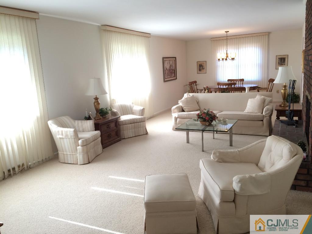 10 Carpender Road New Brunswick, NJ 08901 - Photo 7 of 25 a living room with furniture and a large window