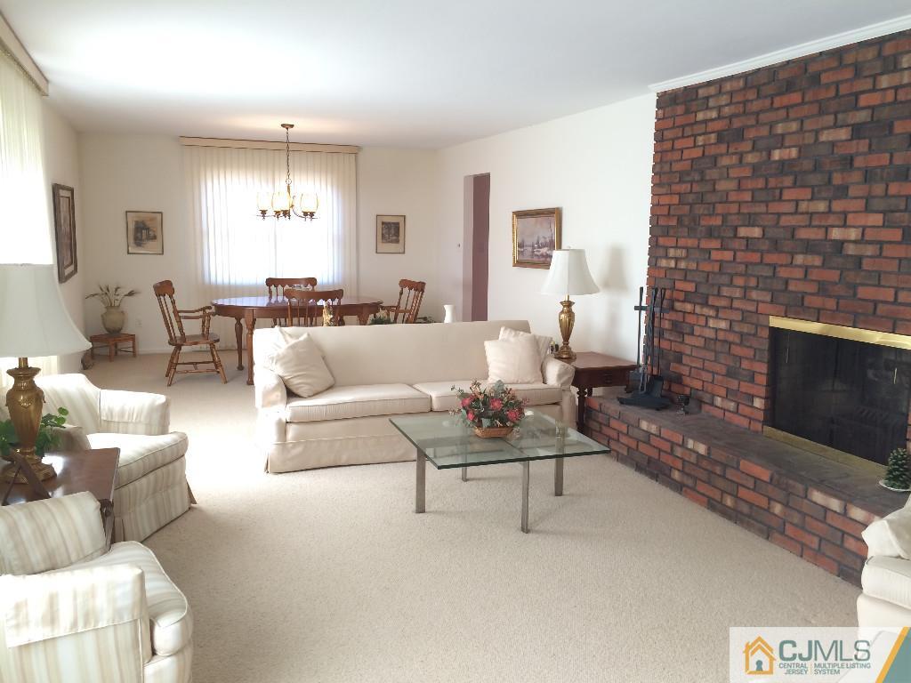 10 Carpender Road New Brunswick, NJ 08901 - Photo 8 of 25 a living room with furniture and a fireplace