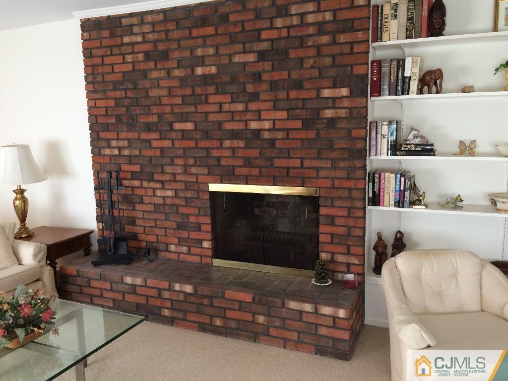 10 Carpender Road New Brunswick, NJ 08901 - Photo 9 of 25 a living room with furniture a rug and a fireplace