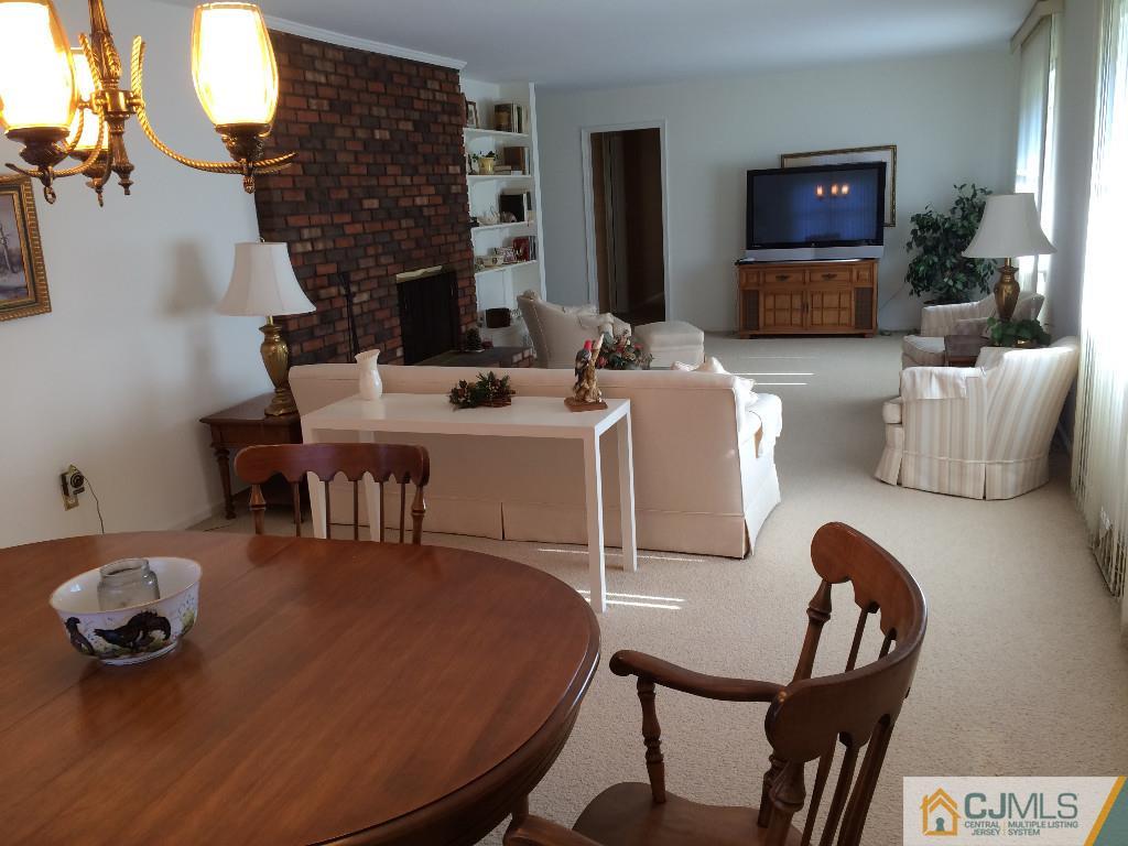 10 Carpender Road New Brunswick, NJ 08901 - Photo 10 of 25 a living room with furniture and a fireplace