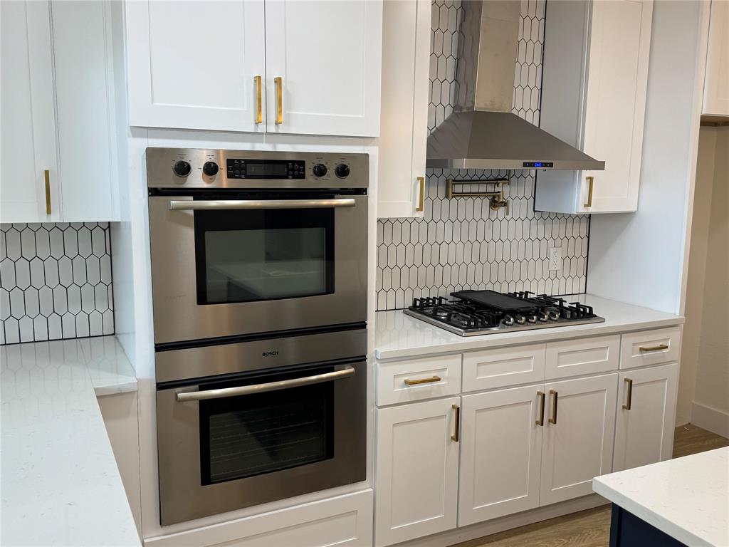 501 Cambridge Drive Richardson, TX 75080 - Photo 19 of 35 a stove top oven sitting inside of a kitchen