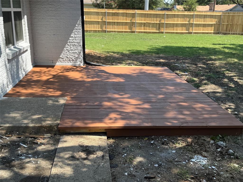 501 Cambridge Drive Richardson, TX 75080 - Photo 30 of 35 a view of a yard with wooden floor
