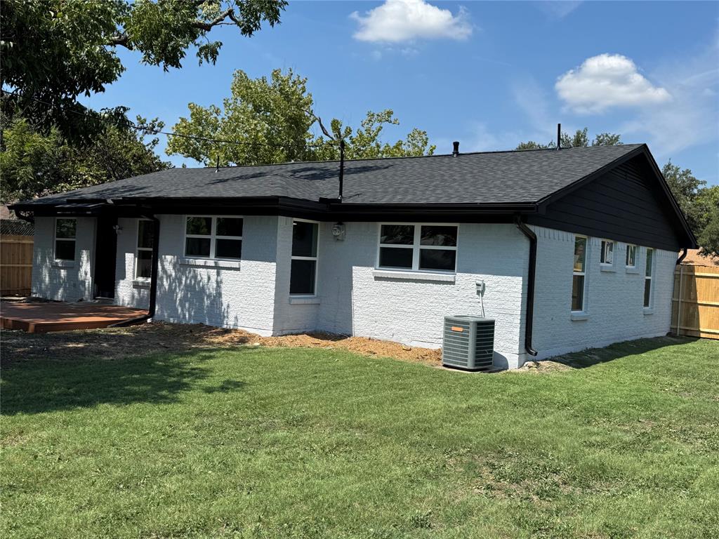 501 Cambridge Drive Richardson, TX 75080 - Photo 33 of 35 a front view of a house with a yard and garage