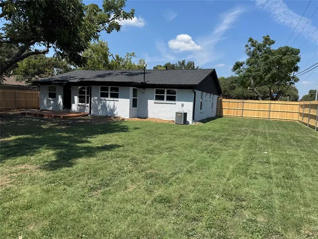a view of a backyard of a house