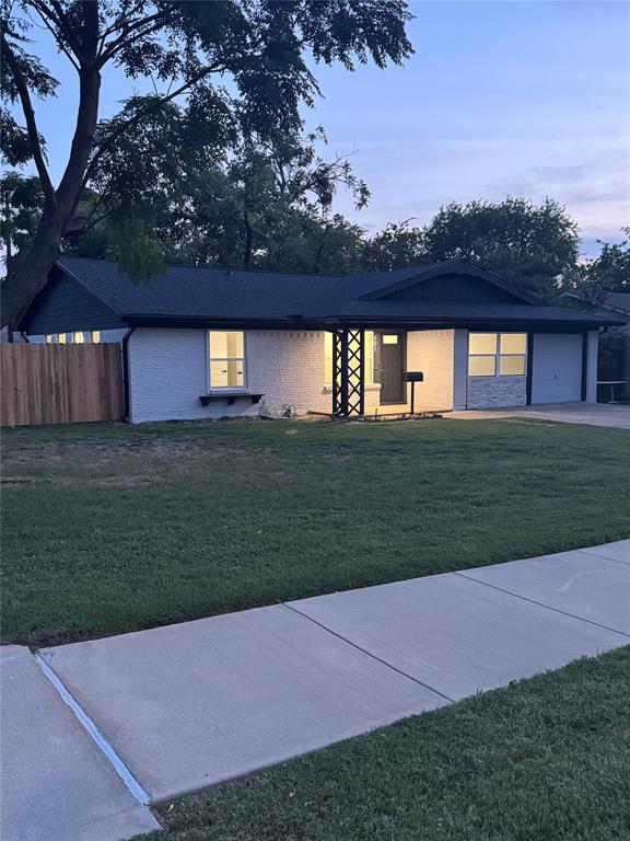 501 Cambridge Drive Richardson, TX 75080 - Photo 4 of 35 a view of a yard with a house in the background