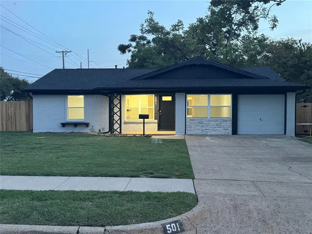 a view of a house with a backyard