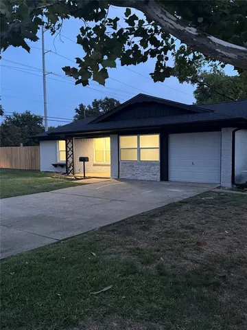 a house view with a garden space