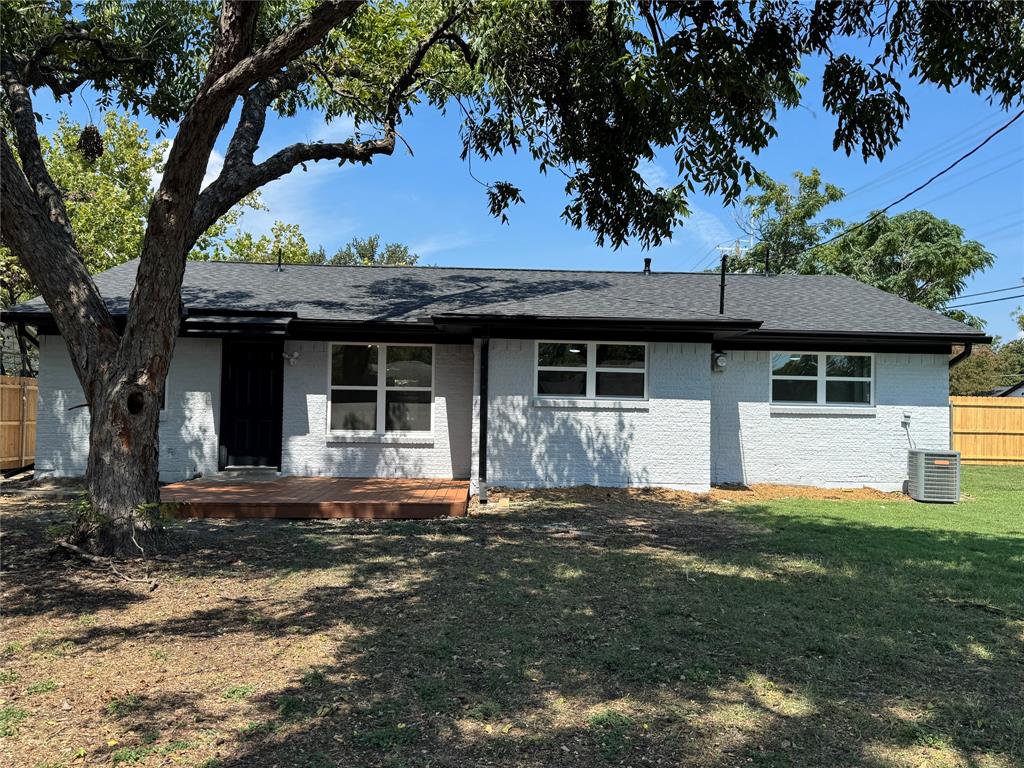 501 Cambridge Drive Richardson, TX 75080 - Photo 9 of 35 a front view of a house with a garden