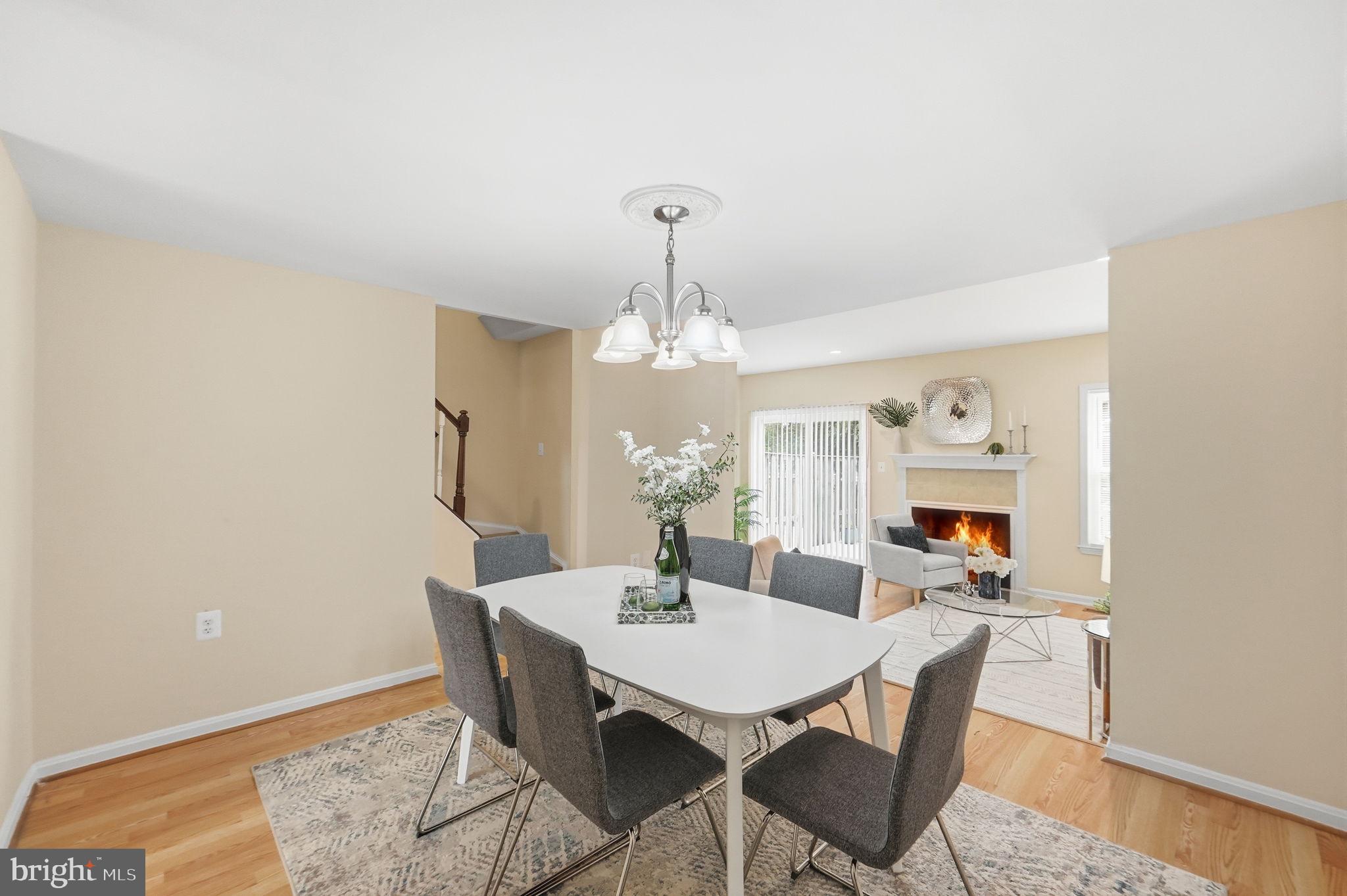 6470 Franconia Court Springfield, VA 22150 - Photo 9 of 31 a view of a dining room with furniture and wooden floor