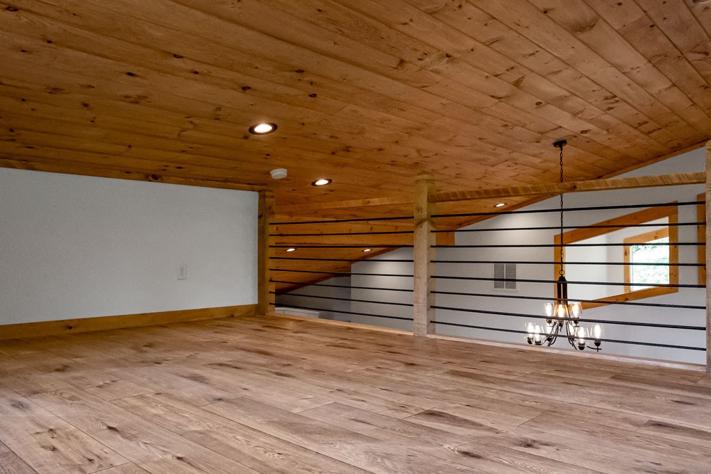 168 Ewing Street Blue Ridge, GA 30513 - Photo 19 of 46 a view of room with wooden floor