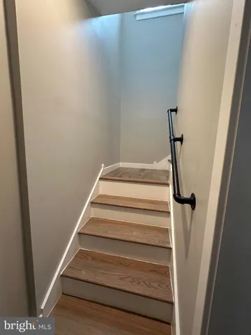 a view of staircase with white walls