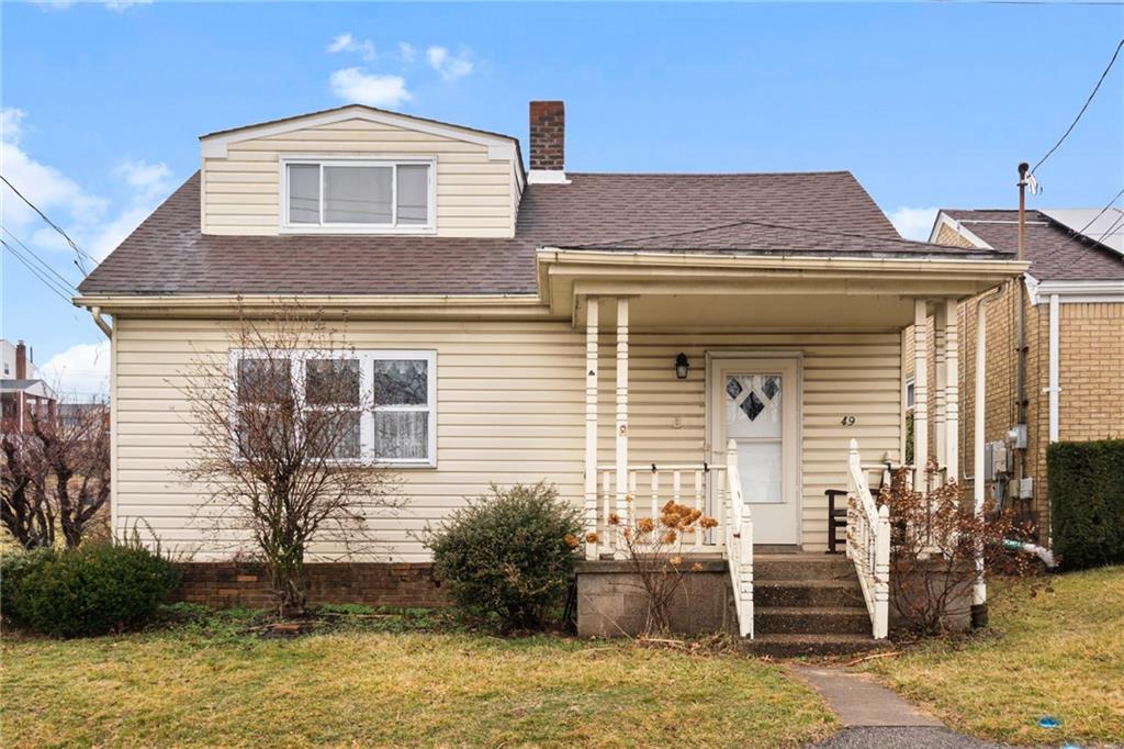 49 Gordon Street McKees Rocks, PA 15136 - Photo 1 of 27 a front view of a house with garden