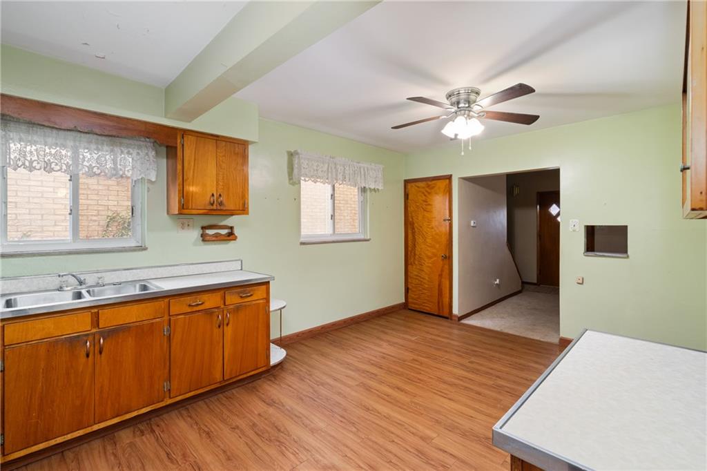 49 Gordon Street McKees Rocks, PA 15136 - Photo 11 of 27 a view of a kitchen with wooden floor and a sink