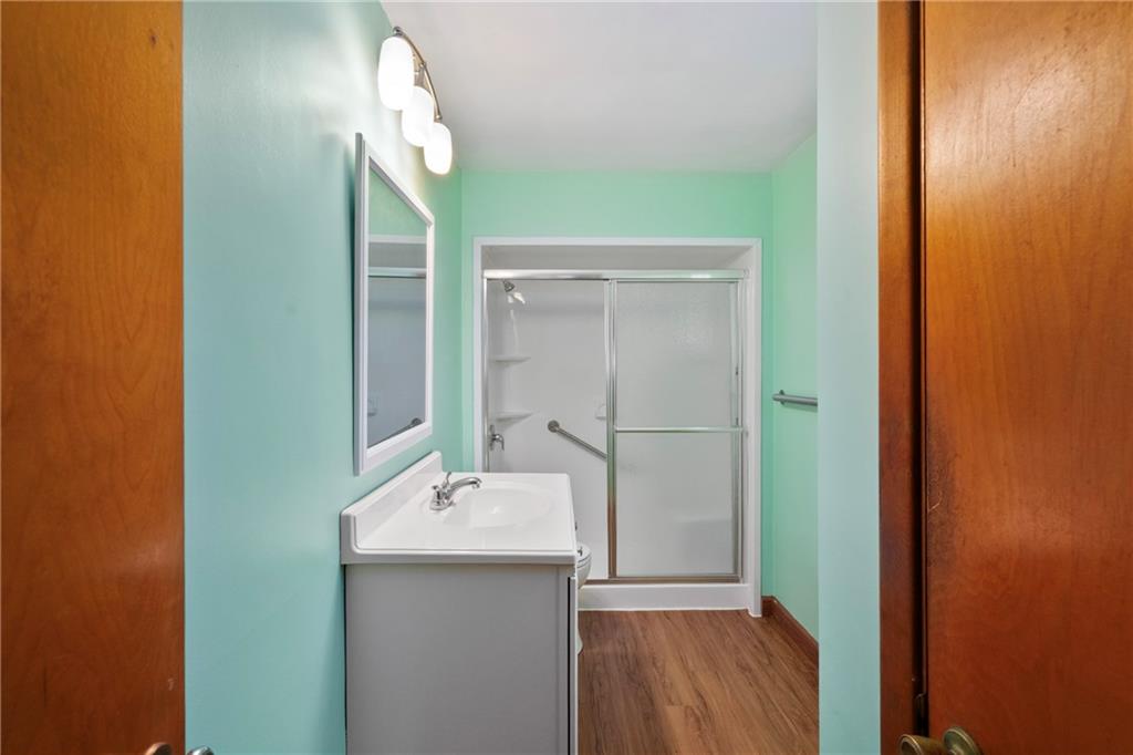 49 Gordon Street McKees Rocks, PA 15136 - Photo 14 of 27 a bathroom with a sink and a mirror