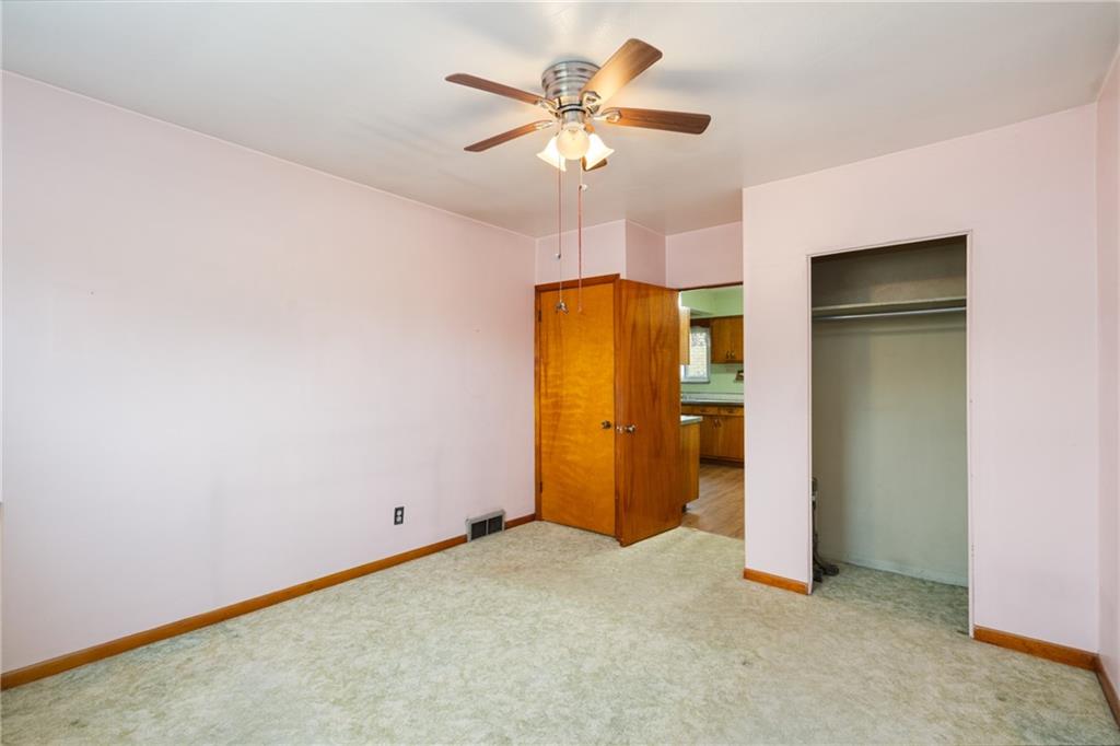 49 Gordon Street McKees Rocks, PA 15136 - Photo 16 of 27 a view of an empty room with a ceiling fan