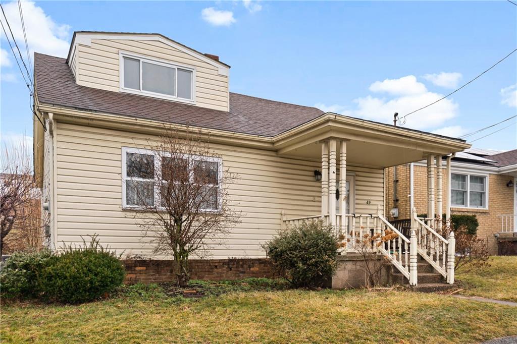 49 Gordon Street McKees Rocks, PA 15136 - Photo 2 of 27 a front view of a house with garden
