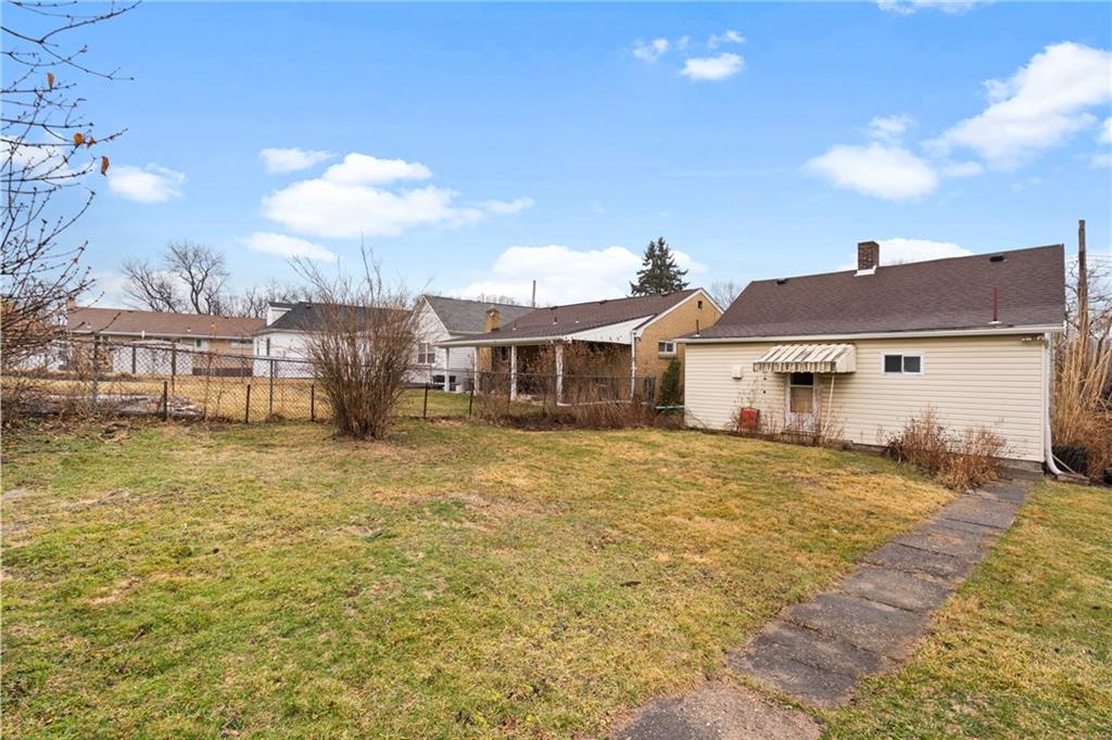 49 Gordon Street McKees Rocks, PA 15136 - Photo 24 of 27 a view of a house with a patio and a yard