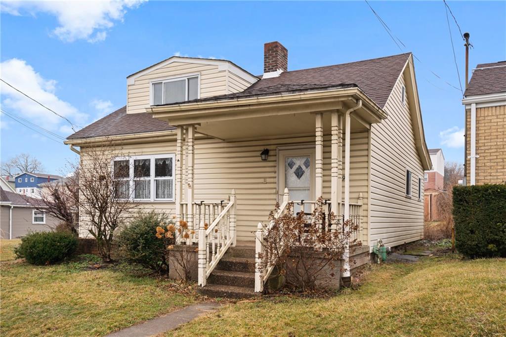 49 Gordon Street McKees Rocks, PA 15136 - Photo 3 of 27 a front view of a house with garden