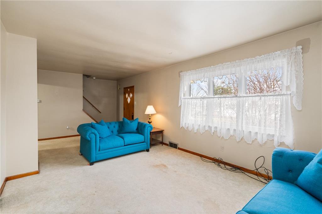 49 Gordon Street McKees Rocks, PA 15136 - Photo 5 of 27 a living room with furniture and a window