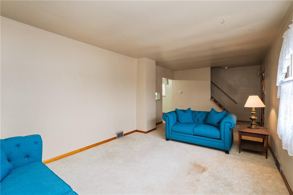 49 Gordon Street McKees Rocks, PA 15136 - Photo 7 of 27 a living room with furniture and a couch