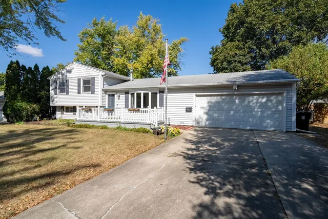 a view of house with outdoor space and swimming pool
