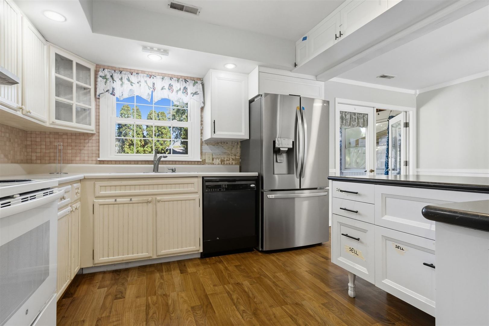 402 Bradley Lane Normal, IL 61761 - Photo 14 of 24 a kitchen with a refrigerator and a stove top oven