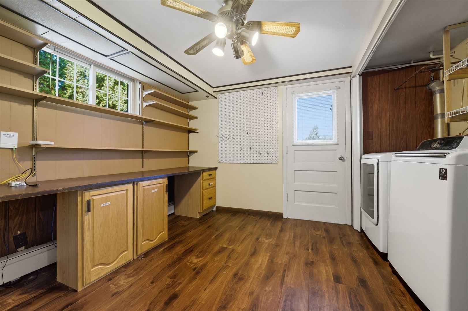 402 Bradley Lane Normal, IL 61761 - Photo 17 of 24 a kitchen with a wooden floor and white appliances
