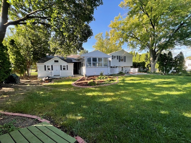 402 Bradley Lane Normal, IL 61761 - Photo 2 of 24 a front view of house with yard and green space