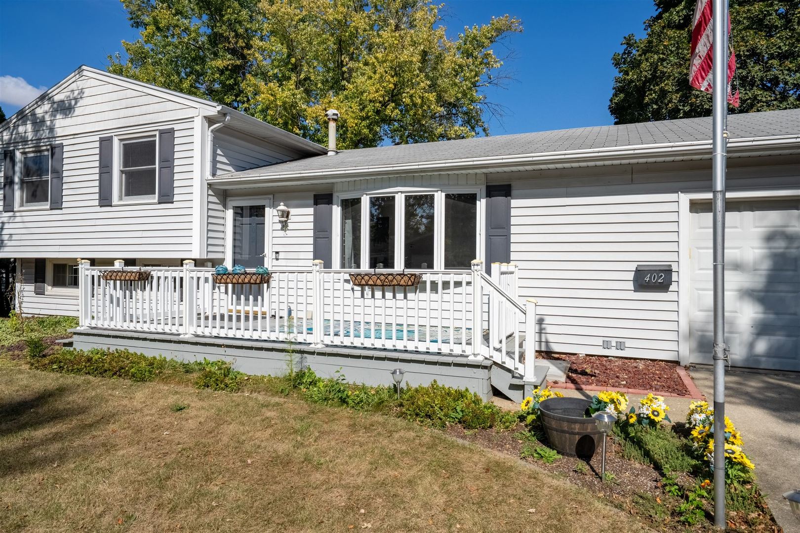 402 Bradley Lane Normal, IL 61761 - Photo 5 of 24 a front view of a house with a small yard