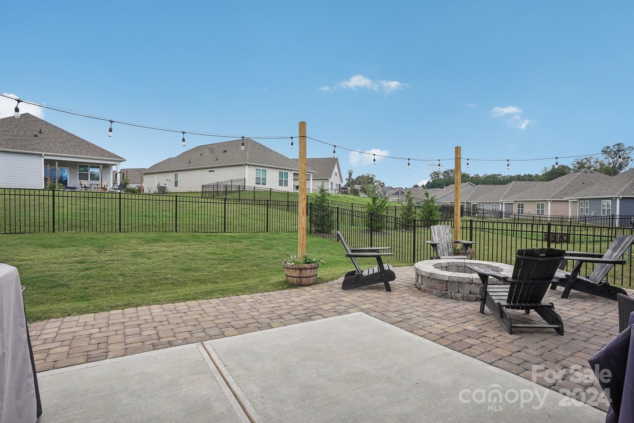4203 Millstream Road Denver, NC 28037 - Photo 19 of 31 a view of a patio with a yard