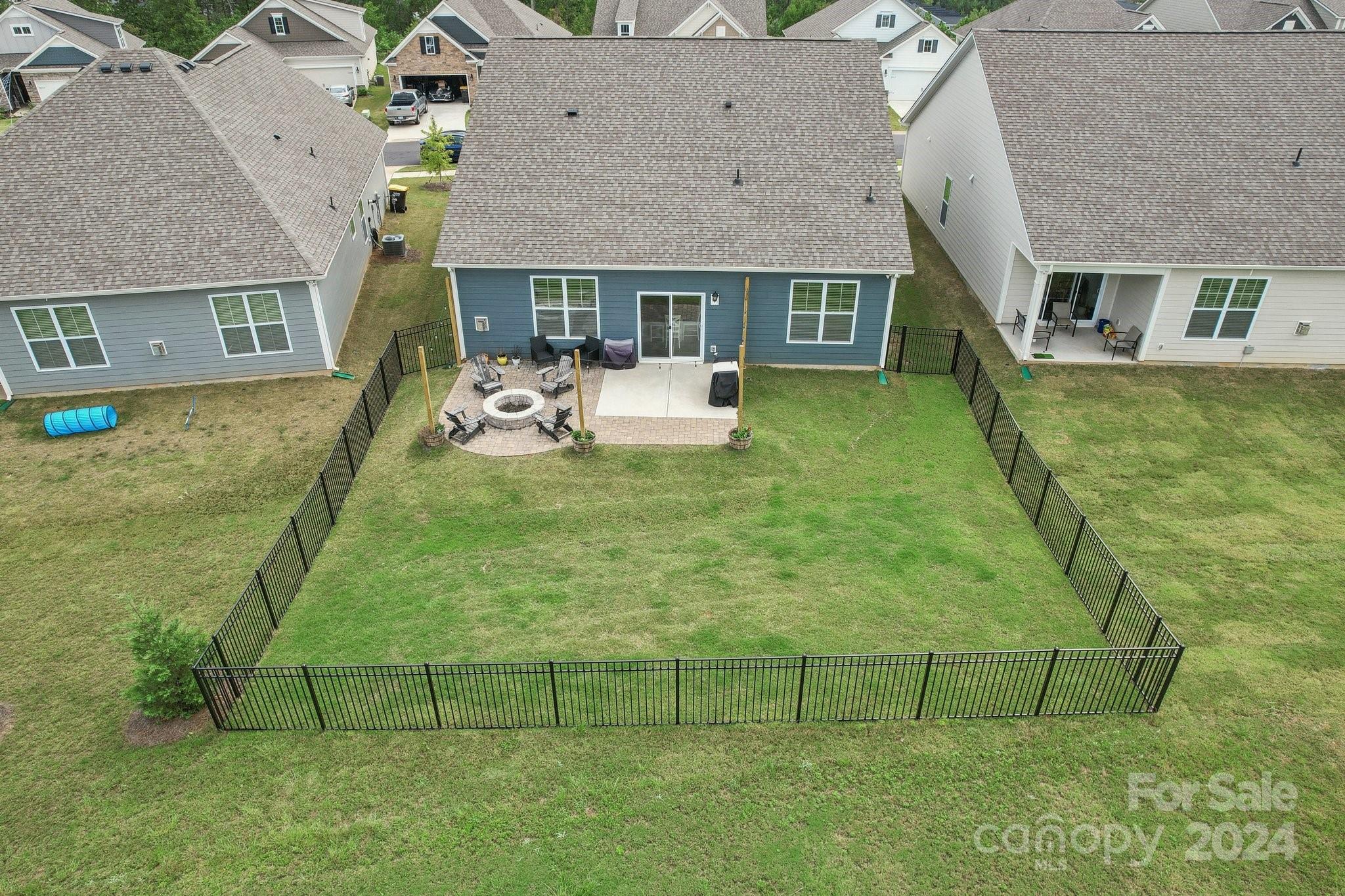 4203 Millstream Road Denver, NC 28037 - Photo 29 of 31 a view of a white house with a big yard and sitting area