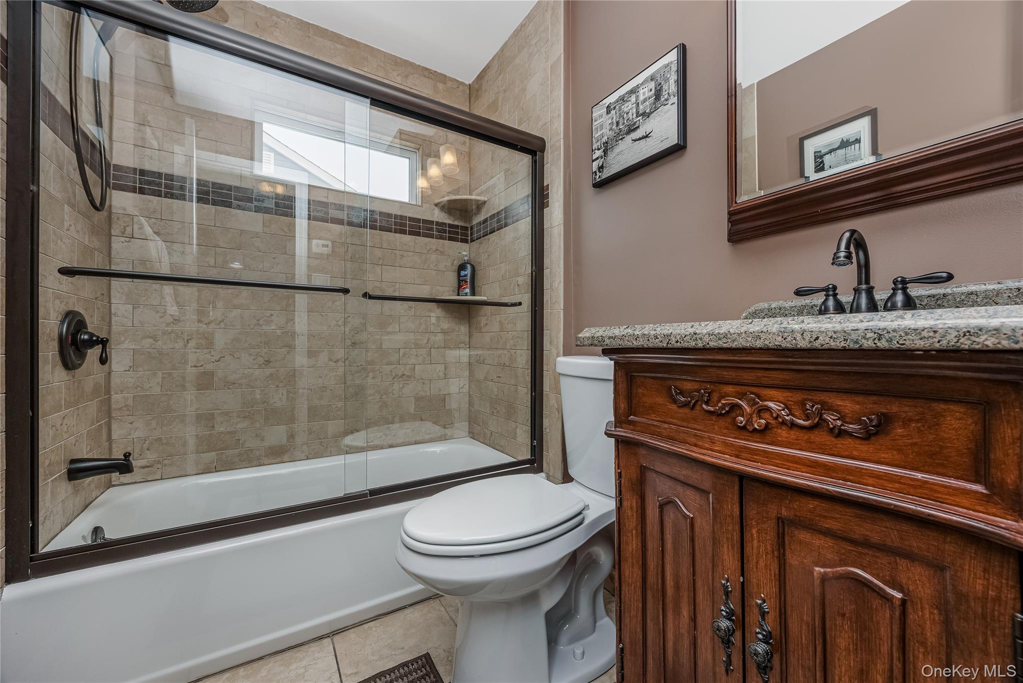 25 Cape Road Amityville, NY 11701 - Photo 12 of 30 a bathroom with a toilet and a shower