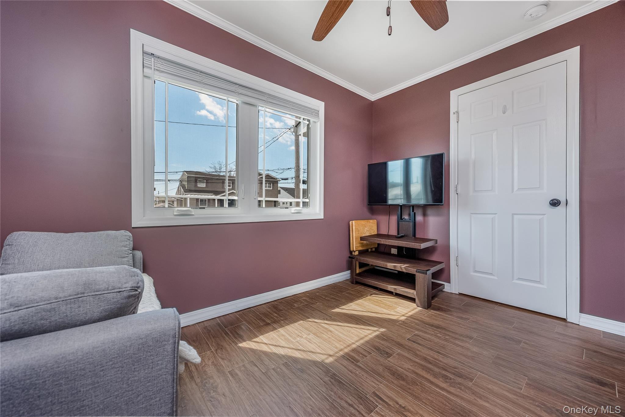 25 Cape Road Amityville, NY 11701 - Photo 13 of 30 a bedroom with furniture and a window