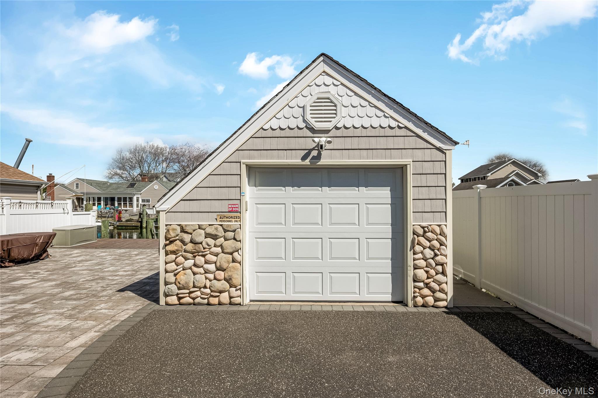 25 Cape Road Amityville, NY 11701 - Photo 19 of 30 a view of a house with a garage