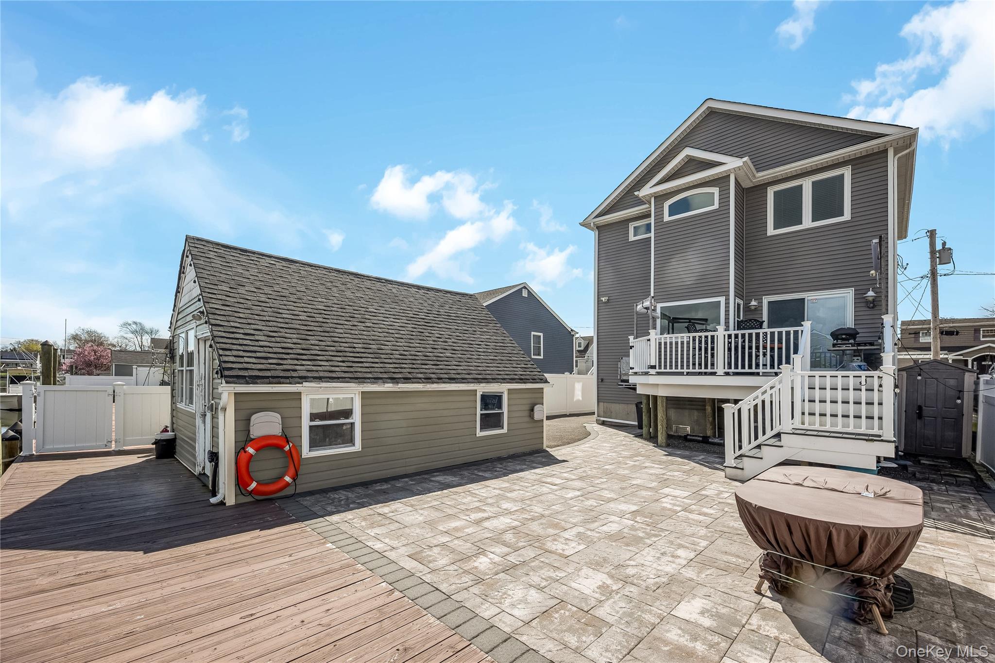 25 Cape Road Amityville, NY 11701 - Photo 22 of 30 a view of house with a barbeque and a stove