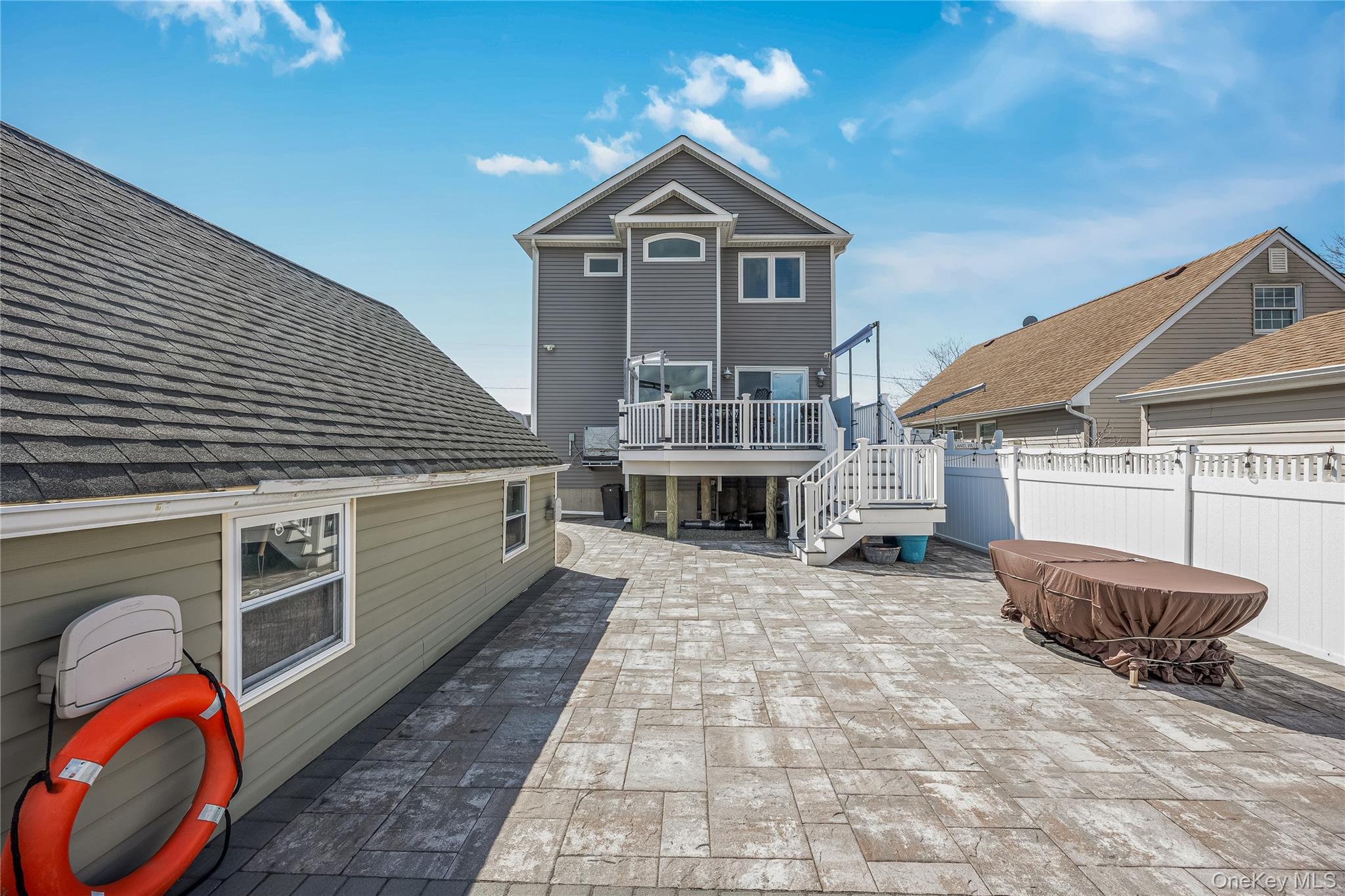 25 Cape Road Amityville, NY 11701 - Photo 23 of 30 a view of a house with a backyard