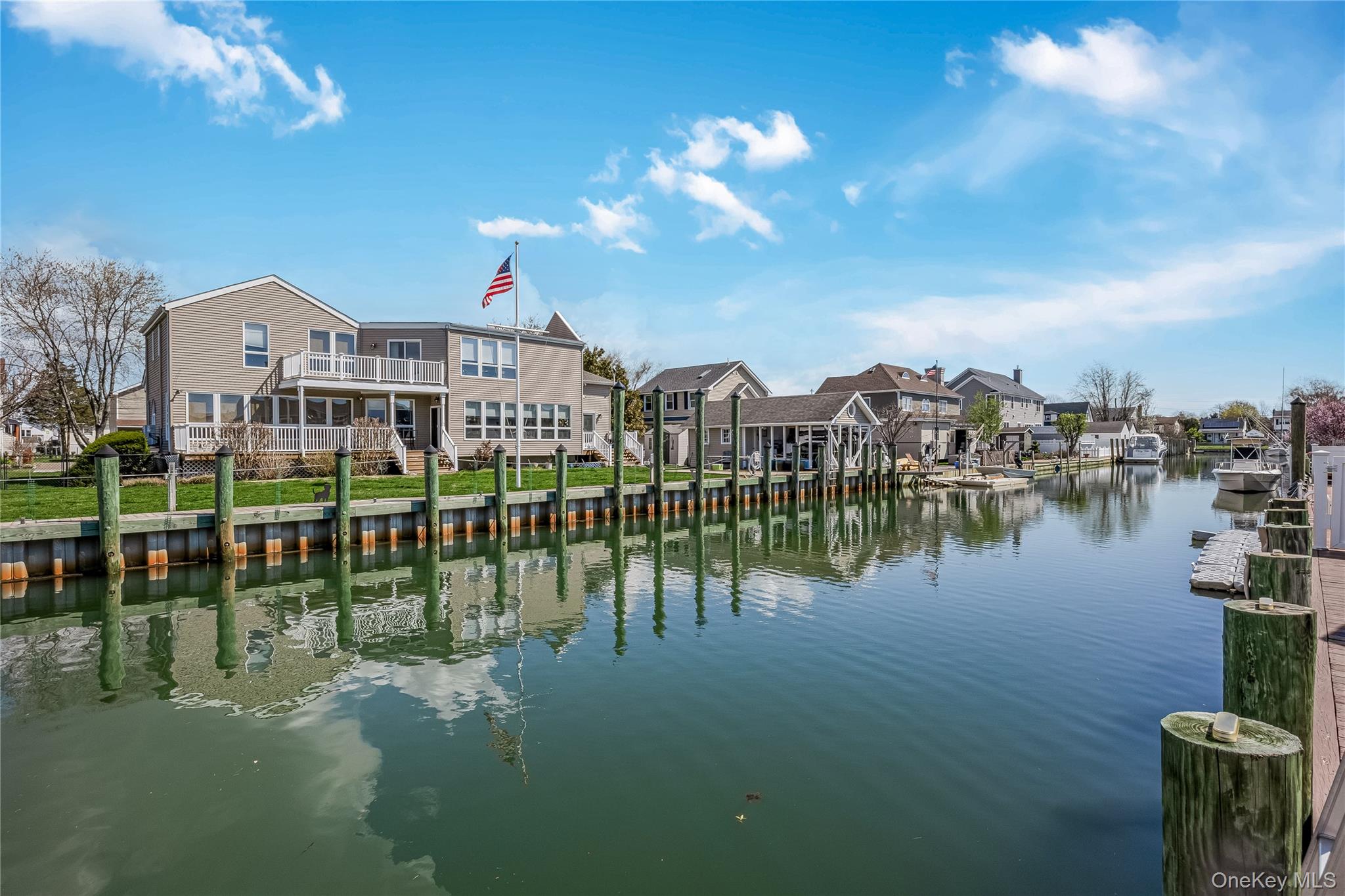 25 Cape Road Amityville, NY 11701 - Photo 25 of 30 a view of a lake with a city