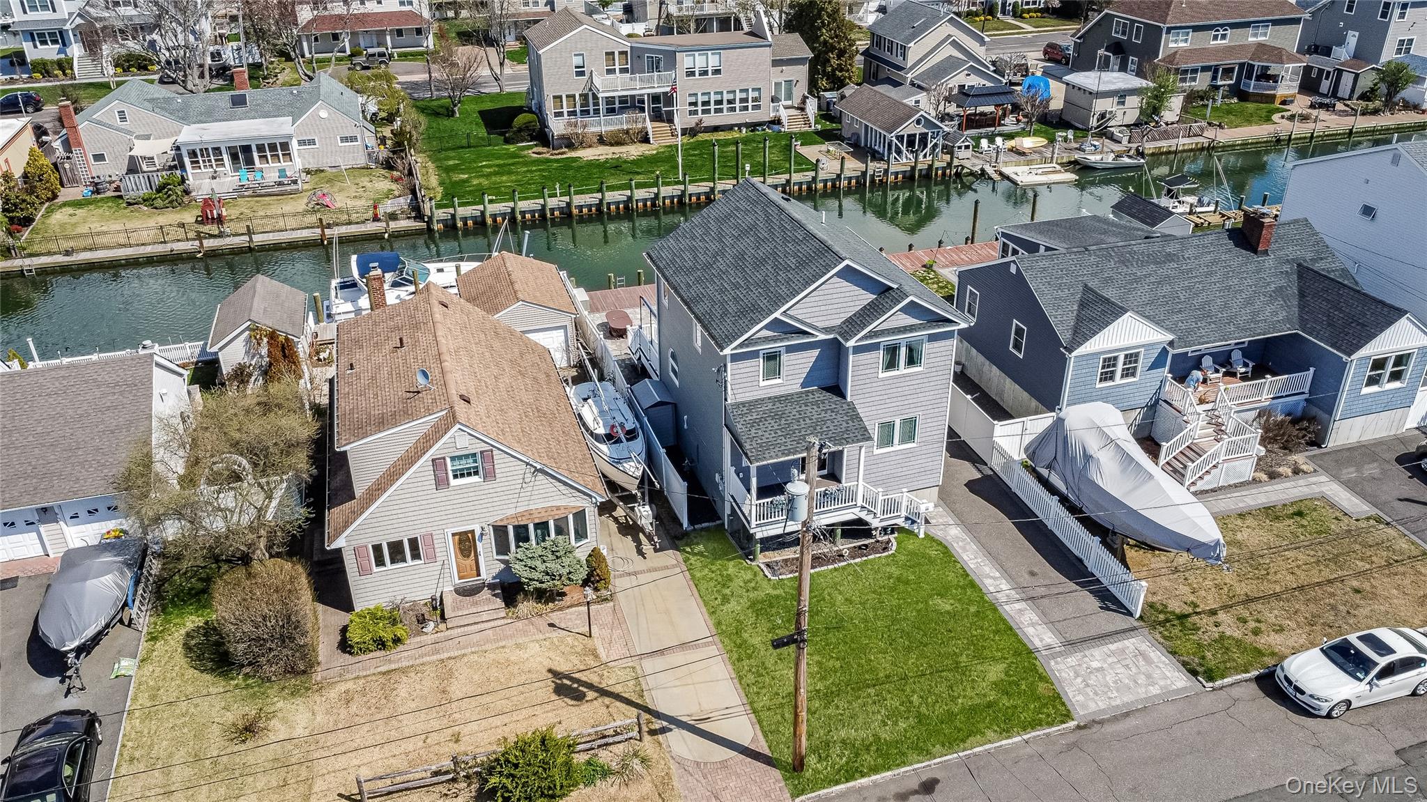25 Cape Road Amityville, NY 11701 - Photo 26 of 30 an aerial view of a house with a lake view