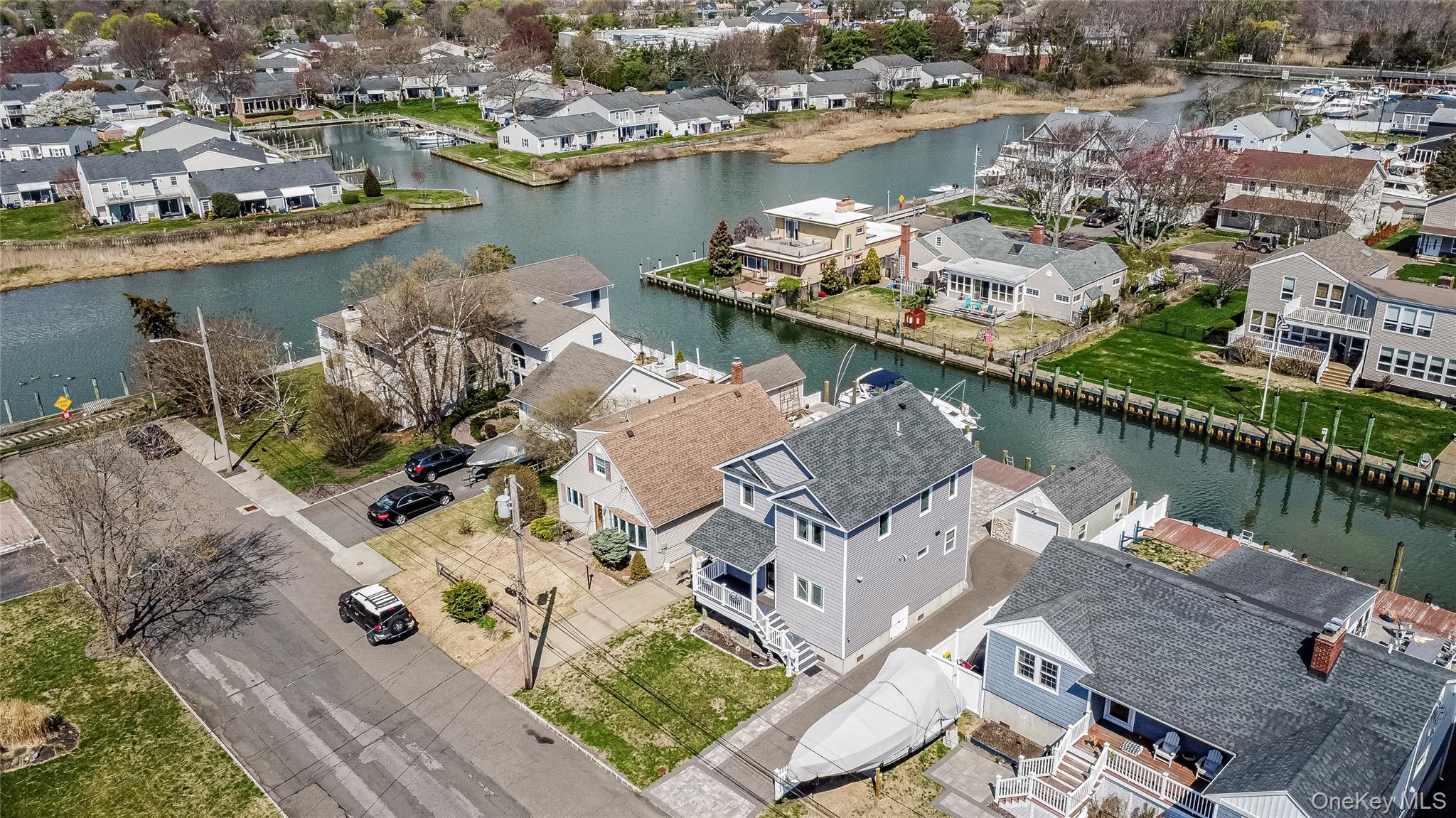 25 Cape Road Amityville, NY 11701 - Photo 27 of 30 an aerial view of a house with a table and a chairs