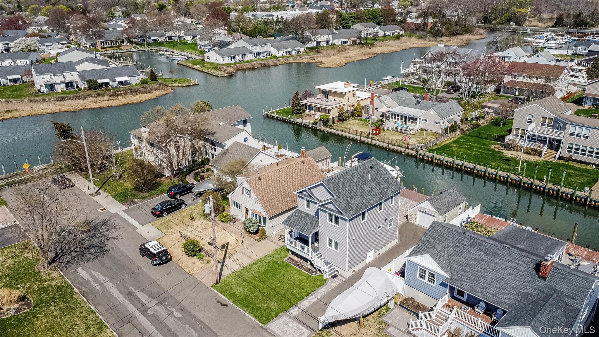 25 Cape Road Amityville, NY 11701 - Photo 28 of 30 an aerial view of a house with a table and chairs